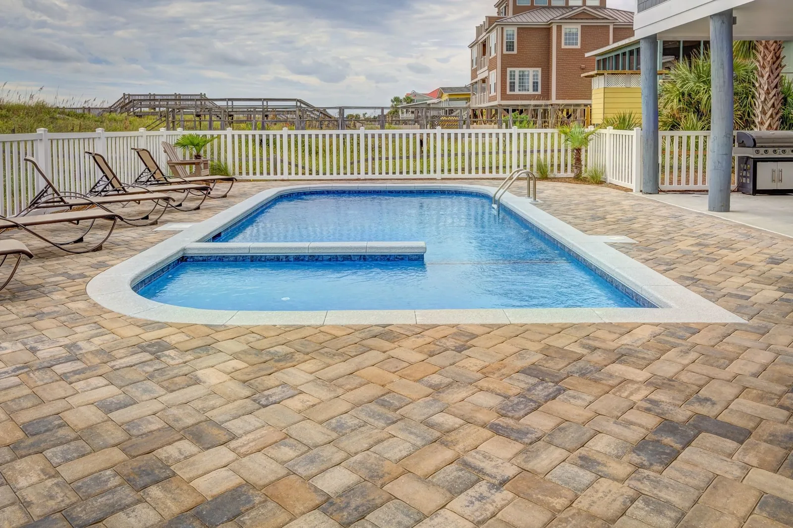 Pool deck resurfacing cost: fresh acrylic coating over an existing concrete slab
