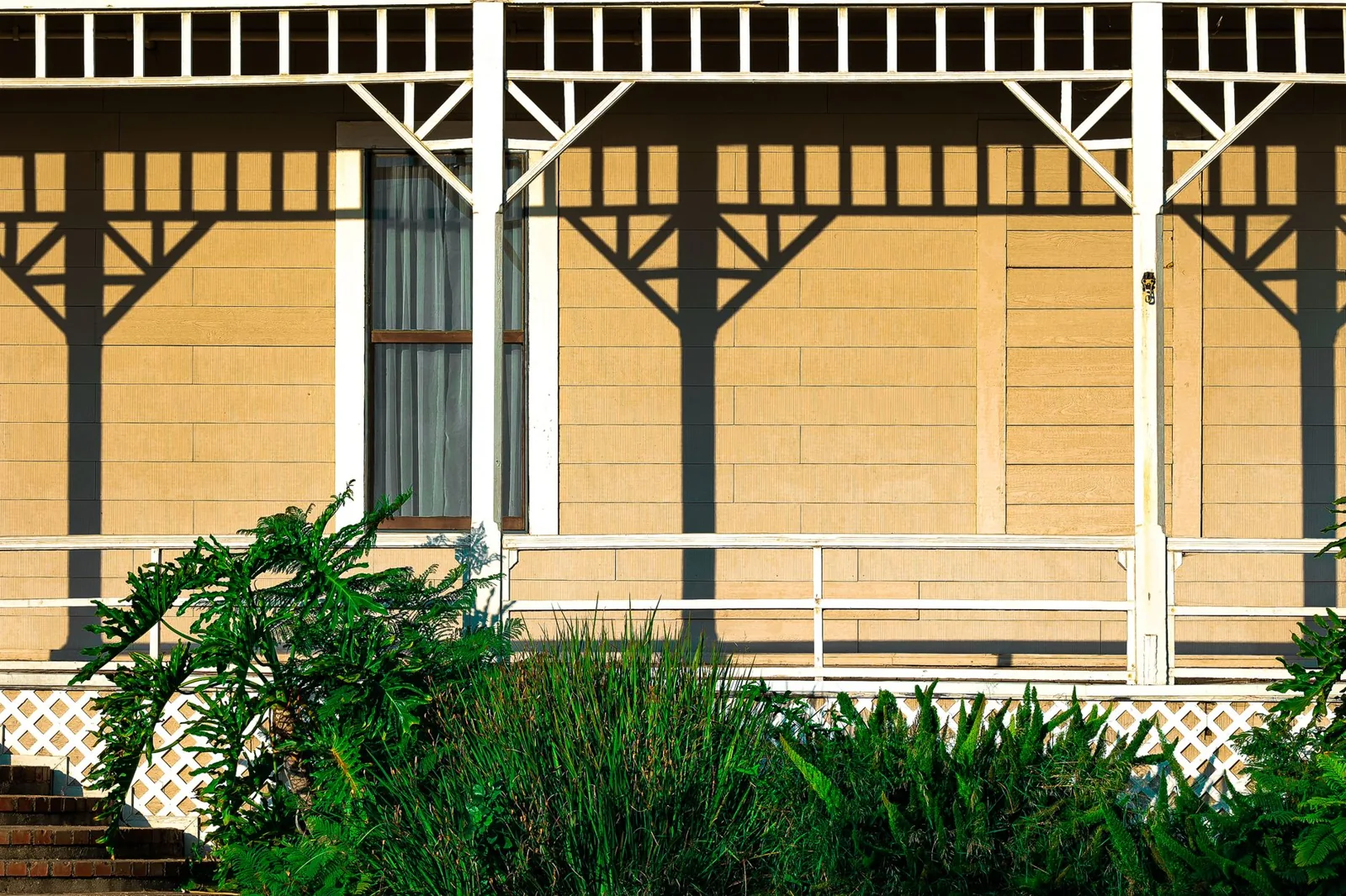 porch railing ideas in a classic painted wood design with turned balusters