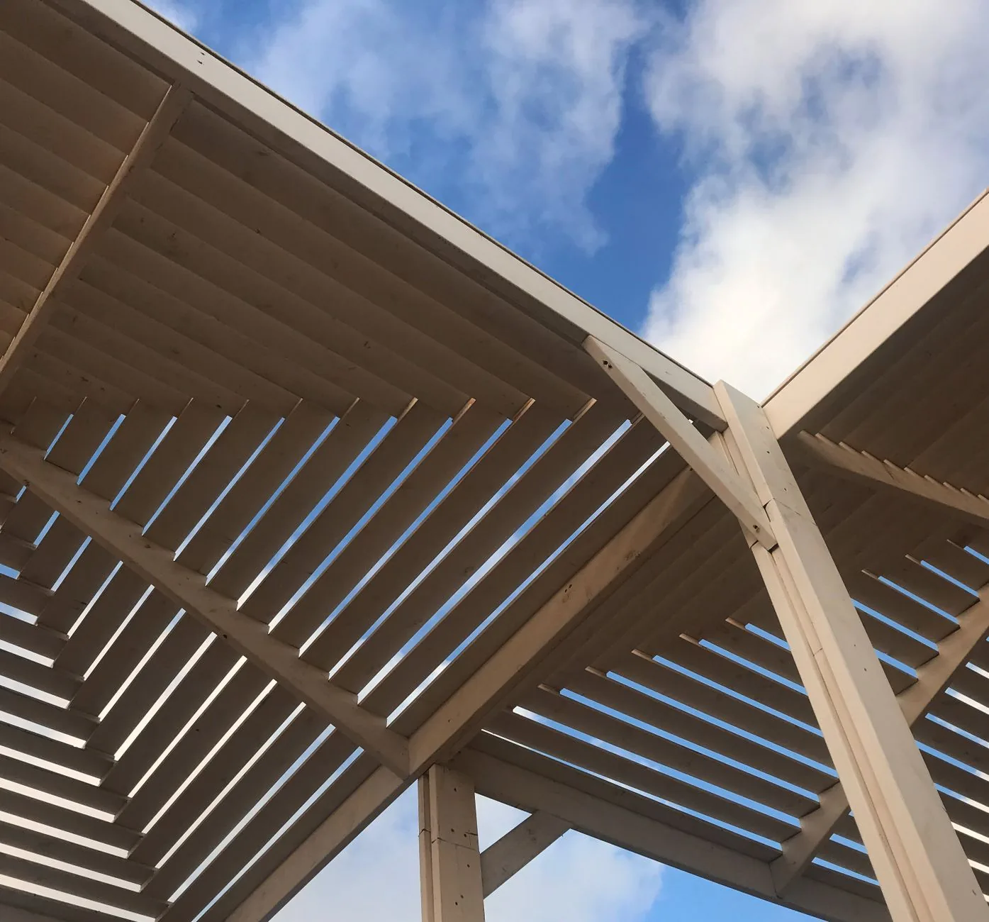 deck skirting ideas for a raised composite deck with horizontal slats