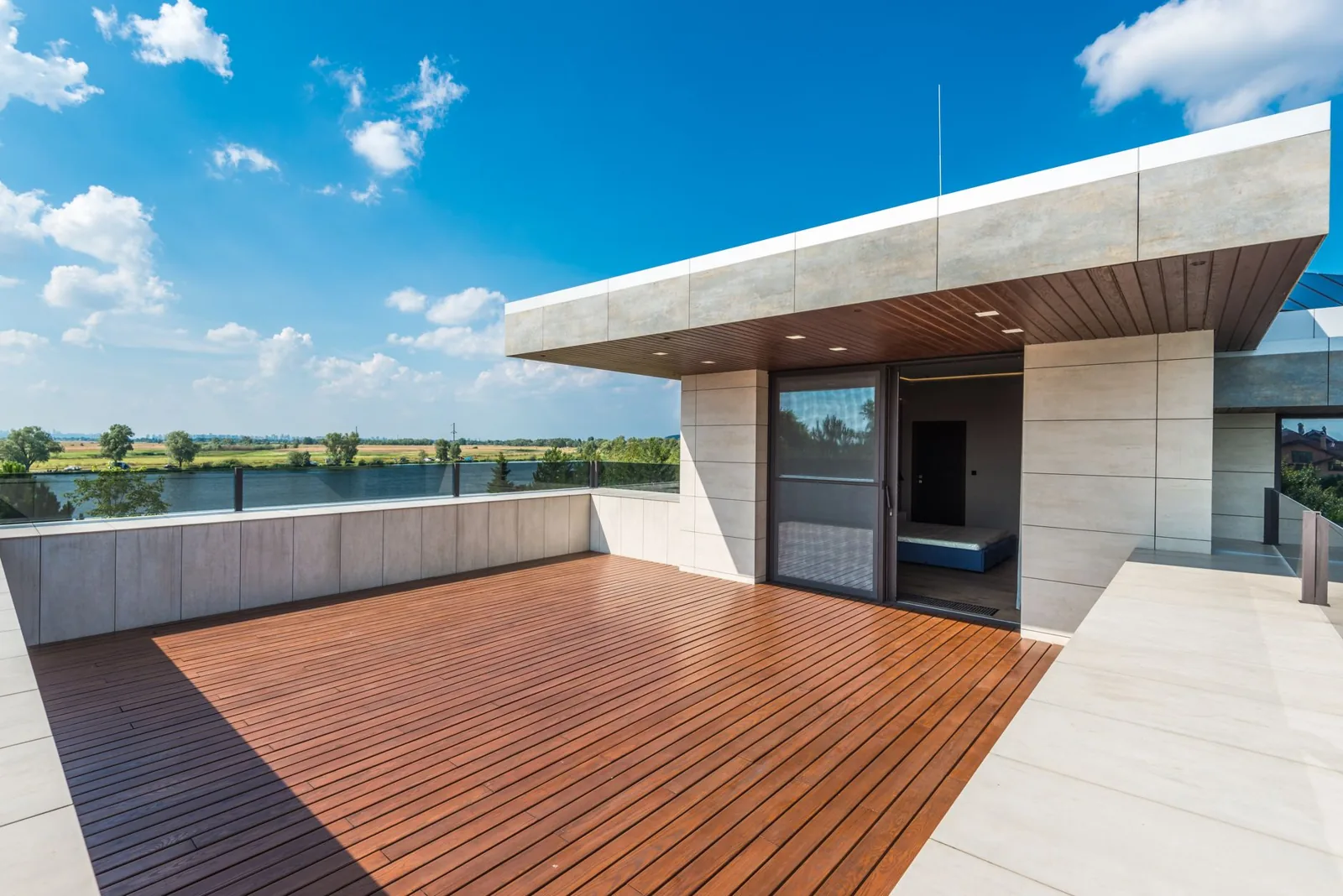 Roof deck design ideas featuring a rooftop dining area and city skyline views