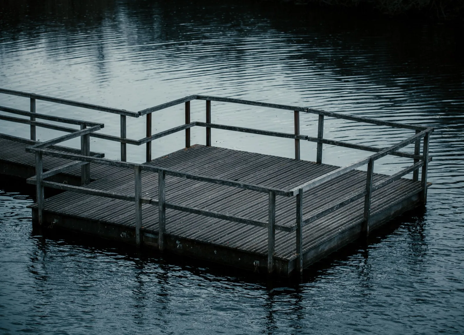 ground-level floating deck with composite boards