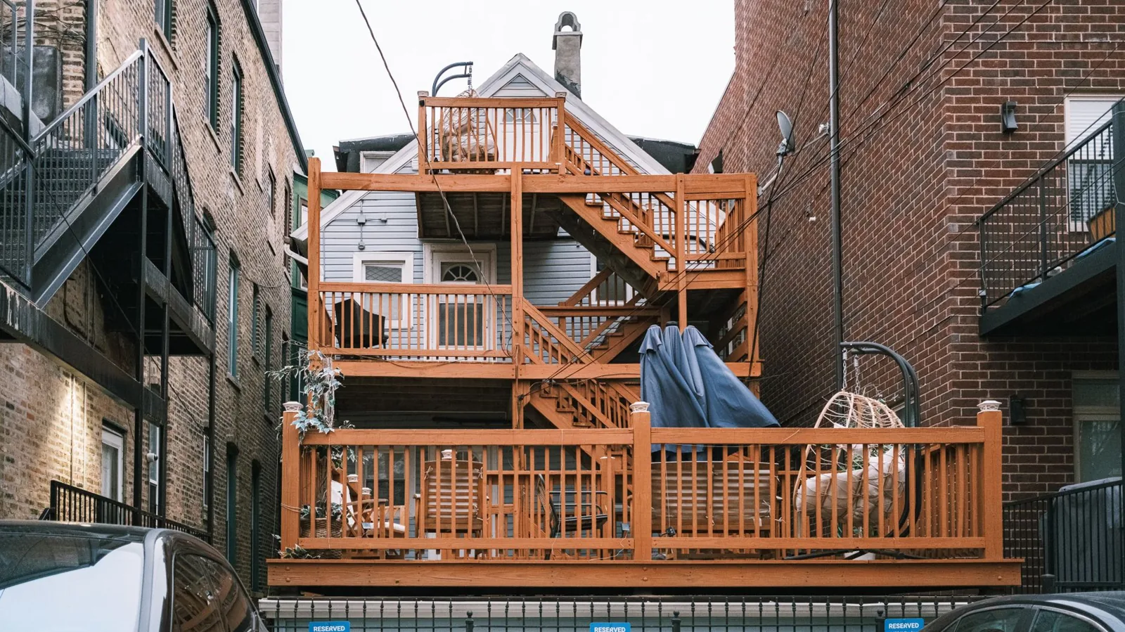 Freestanding deck vs attached: an attached deck with a ledger board connected to the home's back wall